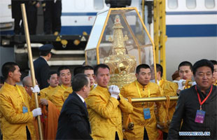 Staff members carrying Buddha's Tooth 