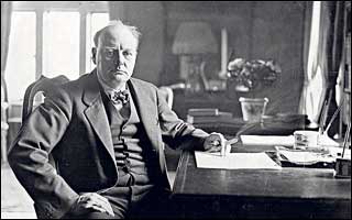 Winston Churchill at his desk 