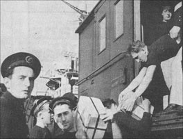 French sailors from the Marseillaise loading gold aboard a railway wagon at Halifax. 