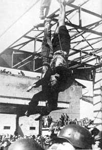 Mussolini hanging upside down.