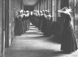 Novices at 140 rue du Bac in their plain headgear watched over by a nun.