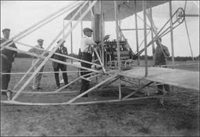 Orville preparing his wheelless plane 