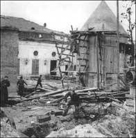 U.S. and Soviet soldiers looking at the supposed remains of Adolf and Eva. 